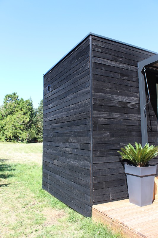 black wood cladding lodges in move project