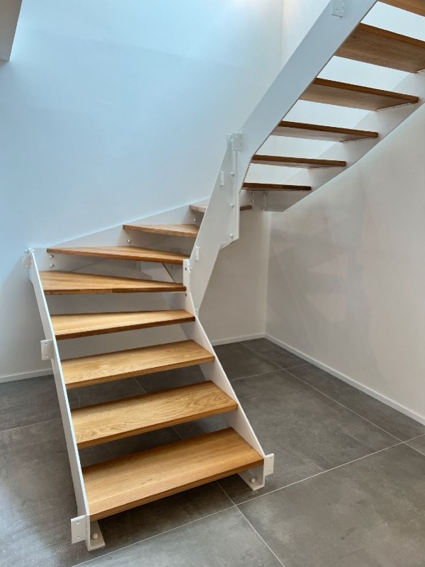 A wooden staircase with PANOPLOT
