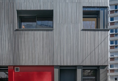 A Parisian residential building with pre-weathered wood cladding